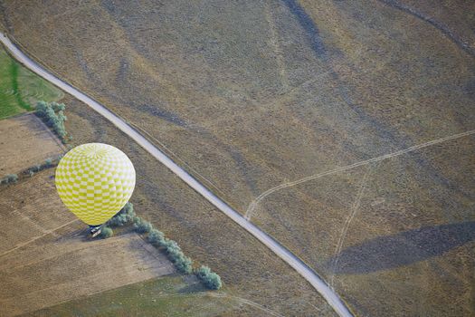 Air balloon flying above the land. Horizontal photo