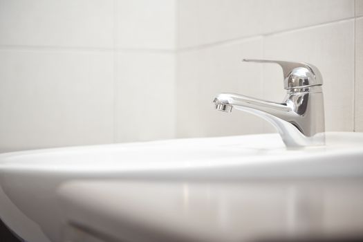Sink with water tap. Close-up horizontal photo