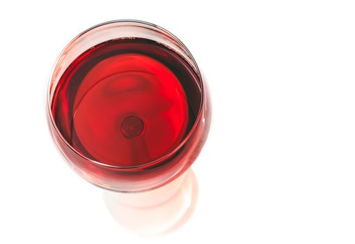 top of view of red wine in the glass isolated on white background