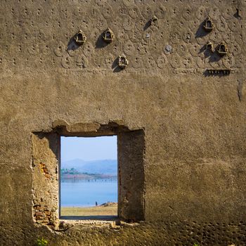 window and wall of Buddhist abandoned Temple in Sagklaburi, Thailand