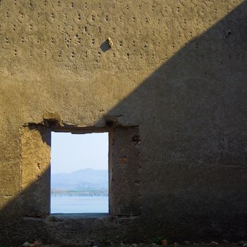 window and wall of Buddhist abandoned Temple in Sagklaburi, Thailand