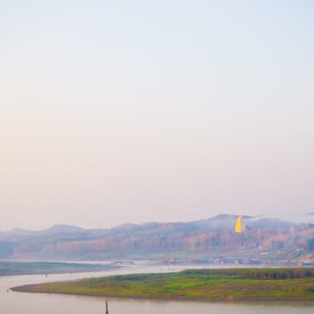 Gold Buddhagaya pagoda, Buddhist sanctuary by Songalia river in the morning at Sangklaburi, Thailand