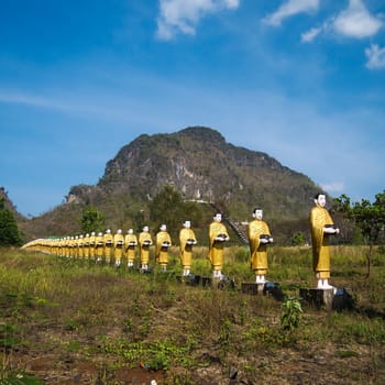 Kayin State, Myanmar - March 6, 2011 : Buddha image statue Burma Style at Tai Ta Ya Monastery or Sao Roi Ton Temple of Payathonsu in the south of Kayin State, Myanmar