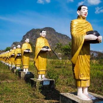 Kayin State, Myanmar - March 6, 2011 : Buddha image statue Burma Style at Tai Ta Ya Monastery or Sao Roi Ton Temple of Payathonsu in the south of Kayin State, Myanmar