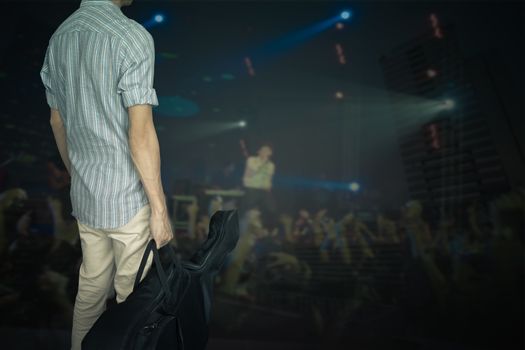 stylish young asian hipster man wear scott strip shirt, hold guitar bag, for concert travelling music concept