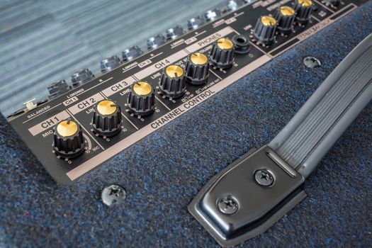 Button of Keyboard Power Amplifier, closeup view background