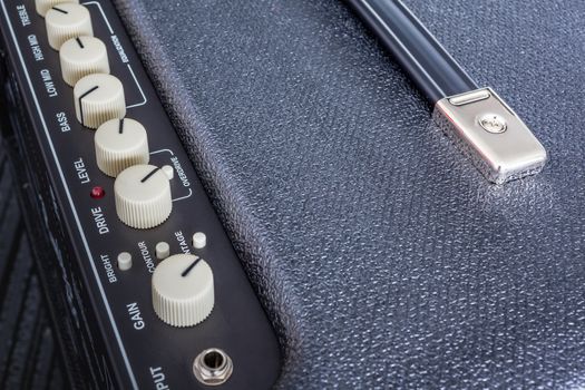 Button of Guitar Power Amplifier, closeup view background