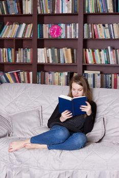 Woman at the library reading a book