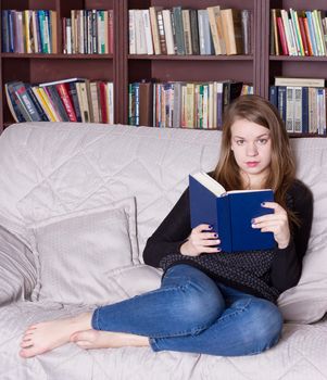 Woman at the library reading a book