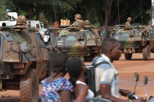 CENTRAL AFRICAN REPUBLIC, Three vehicles of the French Sangaris armed force pass on a street in Bangui, as it patrols in the city, on October 2, 2015. The Central African Republic descended into bloodshed more than two years ago after long time president Francois Bozize, a Christian, was ousted by Seleka rebels, triggering the worst crisis since independence in 1960. On September 29, 2015, Bangui returned to only relative calm after three days of inter-community violence which left at least 40 dead and 100 injured according to the UN Refugee Agency UNHCR. Some 27,000 inhabitants of Bangui have also fled to displaced people's camps.
