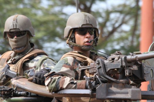 CENTRAL AFRICAN REPUBLIC, Two French Sangaris armed force soldiers stands in their tank in Bangui, as they patrols in the city, on October 2, 2015. The Central African Republic descended into bloodshed more than two years ago after long time president Francois Bozize, a Christian, was ousted by Seleka rebels, triggering the worst crisis since independence in 1960. On September 29, 2015, Bangui returned to only relative calm after three days of inter-community violence which left at least 40 dead and 100 injured according to the UN Refugee Agency UNHCR. Some 27,000 inhabitants of Bangui have also fled to displaced people's camps.