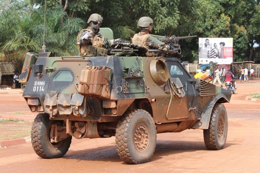 CENTRAL AFRICAN REPUBLIC, One vehicle of the French Sangaris armed force passes on a street in Bangui, as it patrols in the city, on October 2, 2015. The Central African Republic descended into bloodshed more than two years ago after long time president Francois Bozize, a Christian, was ousted by Seleka rebels, triggering the worst crisis since independence in 1960. On September 29, 2015, Bangui returned to only relative calm after three days of inter-community violence which left at least 40 dead and 100 injured according to the UN Refugee Agency UNHCR. Some 27,000 inhabitants of Bangui have also fled to displaced people's camps.