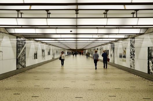 Brussels, Belgium - May 12, 2015: Travellers in the futuristic corridor of Brussels Central Train Station on May 12, 2015 in Brussels , Belgium.