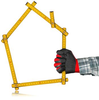 Hand with red and black work glove holding a yellow wooden meter ruler in the shape of house isolated on white background. Concept of house project 
