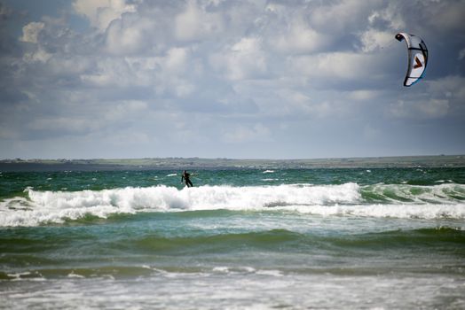 kite surfer on beautiful waves at beach in ballybunion county kerry ireland on the wild atlantic way