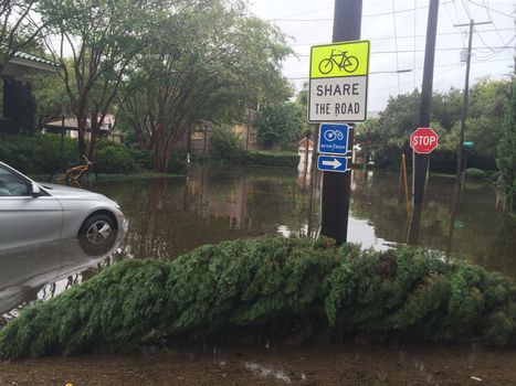 UNITED-STATES, Charleston : Wheel rims of a running car are under water when catastrophic floods ravaged much of South Carolina on October 4, 2015. Heavy rains dropped nearly 17 inches on the state capital of Charleston in a 17 hour span. At least nine people died in South Carolina as a result of the flooding and one person has died in neighboring North Carolina. The storms also left some 30,000 residents without power and shut down many major roads. Governor Nikki Haley called the rains the worst in 1,000 years. 