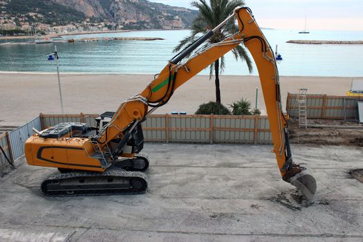 Crawler Excavator on a construction site near the beach in Menton
