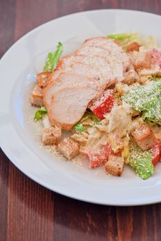 Chicken ceasar salad closeup photo