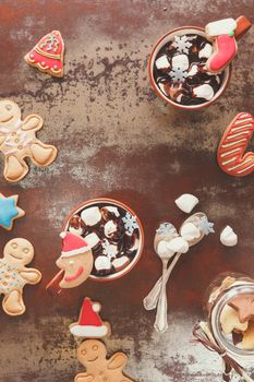 Hot chocolate with marshmallow and gingerbread cookies. Vintage style with blank space, top view
