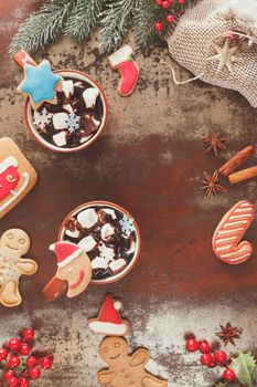 Hot chocolate with marshmallow and gingerbread cookies. Christmas decorations. Vintage style with blank space, top view