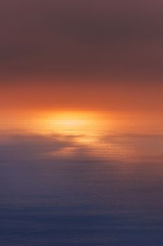 Sunlight reflecting off water. Scenic view of sunset over sea seen from a cruiser. Suitable for background.