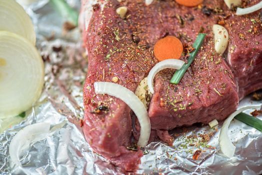 Raw beef meat seasoned and ready to cooked