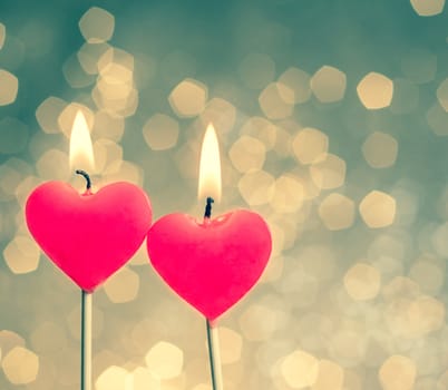 hearts candles on vintage bokeh as background vintage style, valentine day and love concept