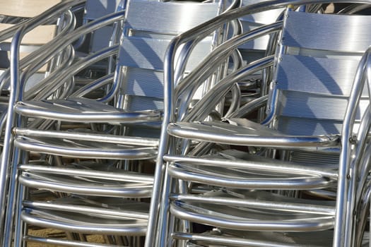 Stacked aluminium chairs