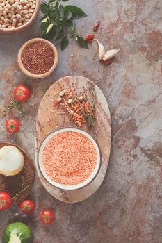 Red lentil soup with Chickpeas and Quinoa. Red lentil soup with chickpeas, vegetable and spices being prepared, top view