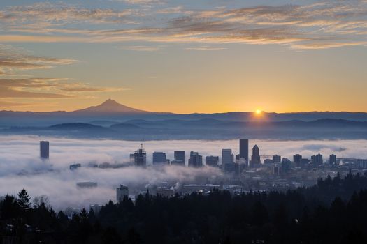 Sunrise over City of Portland Oregon and Mount Hood Covered in Low Fog Banks