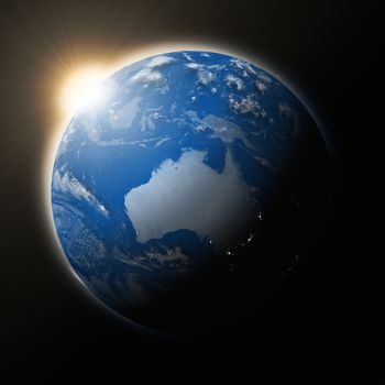 Sun over Australia on blue planet Earth isolated on black background. Highly detailed planet surface. Elements of this image furnished by NASA.