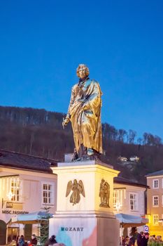 Salzburg, Austria - December 31, 2013: The statue of Mozart at Mozart Square at night.