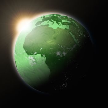 Sun over Africa on green planet Earth isolated on black background. Highly detailed planet surface. Elements of this image furnished by NASA.