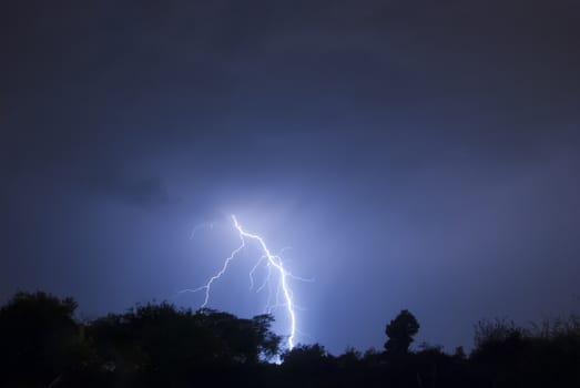 Lightning flash on a thunder storm in the night skies