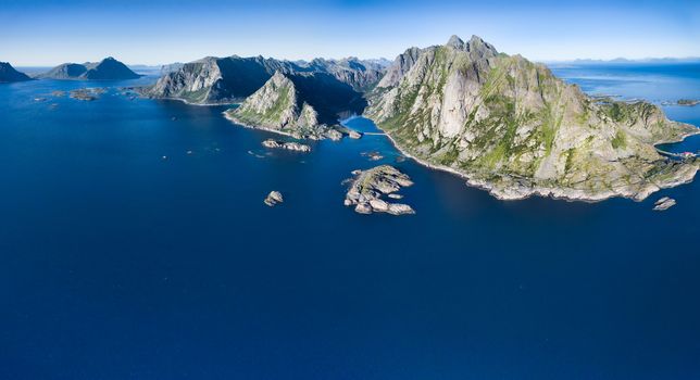 Aerial panorama of Lofoten coastline with its magnificent mountain peaks, Norway