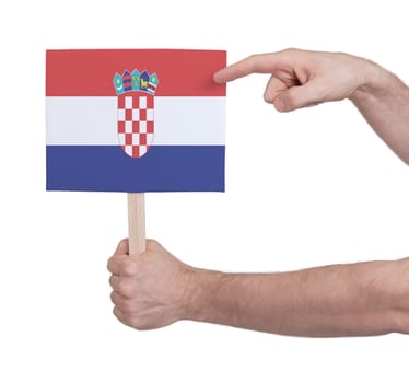 Hand holding small card, isolated on white - Flag of Croatia