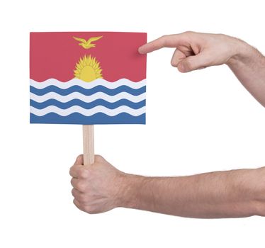 Hand holding small card, isolated on white - Flag of Kiribati