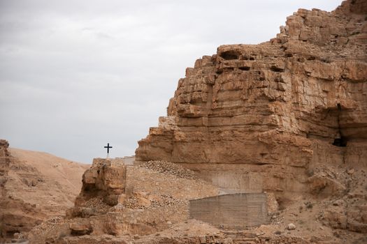 A cross in israeli judean desert - christianity travel