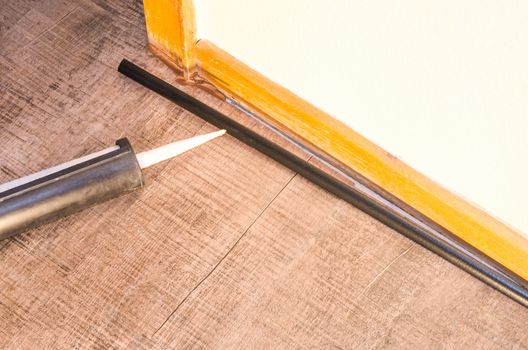 Application of caulking gun, applying glue, attachment page footer .