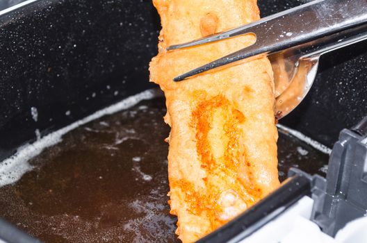 Fresh coley fillet done in beer batter for the fryer.