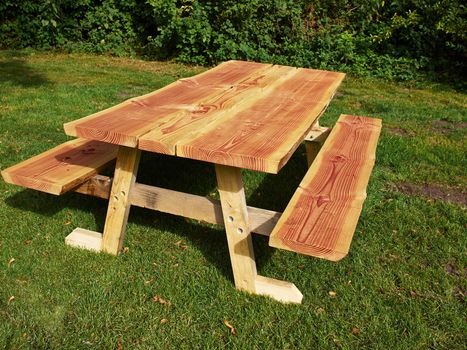 Rustic style Picnic Table made of wood in a camping site