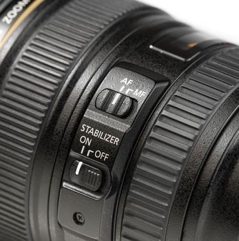 close up stabilizer button on photo camera lens