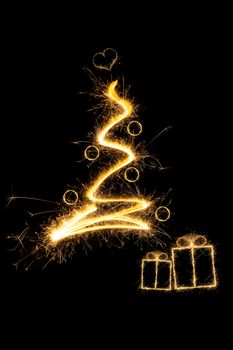 Merry christmas. Sparkling firework christmas tree with christmas presents. Minimal abstract artistic style.