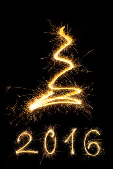 Merry christmas and happy new year 2016. Sparkling firework christmas and new year text on black background. Minimal abstract artistic style.