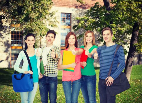 education and people concept - group of smiling students standing