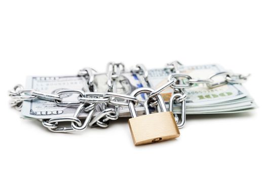 Business safety and finance protection concept - metal chain link with locked padlock on dollar currency money white isolated