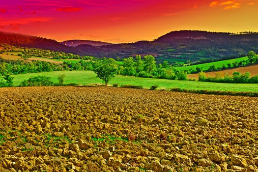Village Surrounded by Fields in the France; Sunset