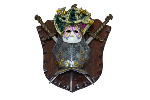 The photo shows a mask, shield and swords
