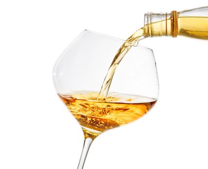 pouring white wine into a glass on white background with space for text