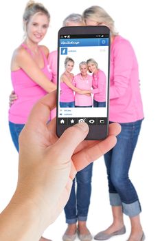 Female hand holding a smartphone against photo sharing app